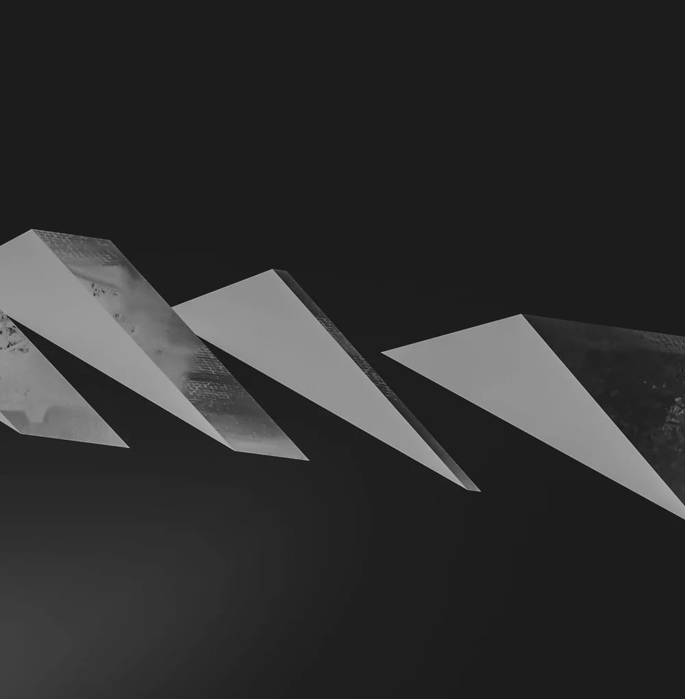 An abstract three dimensional render of pale angular planes on a dark field